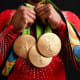 Biles shows off her gold medals from Rio 2016.